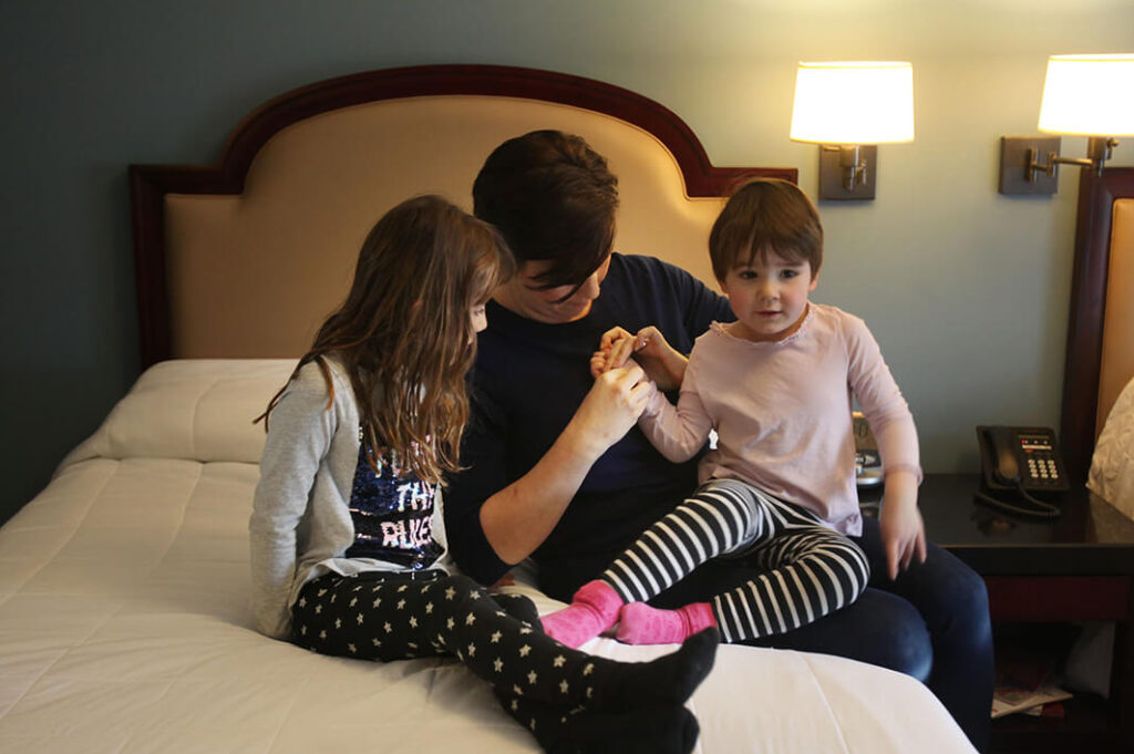 Woman with children in a room at RMHC of Central Ohio