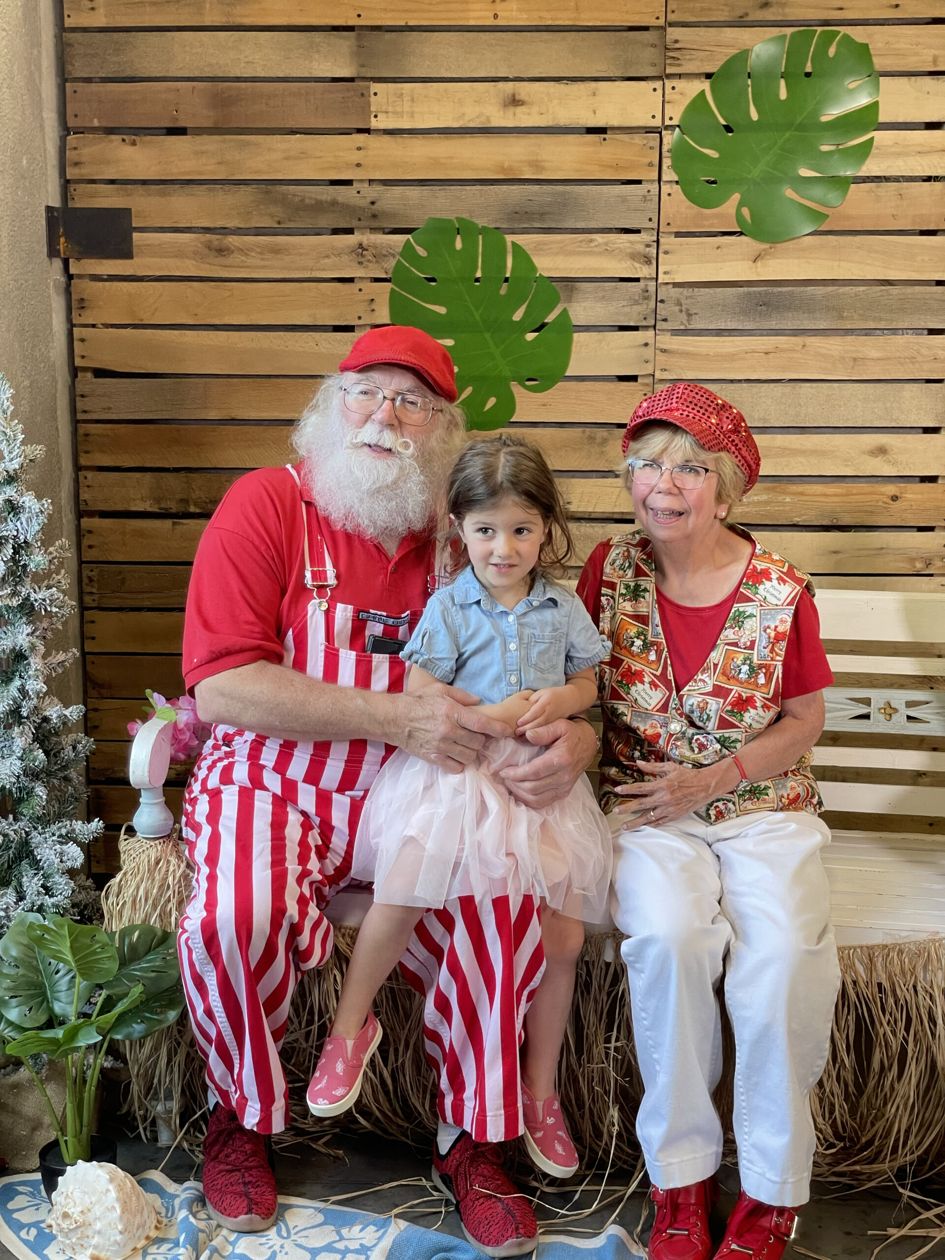 Christmas in July Santa and Mrs.Clause with child at RMHC of Central Ohio