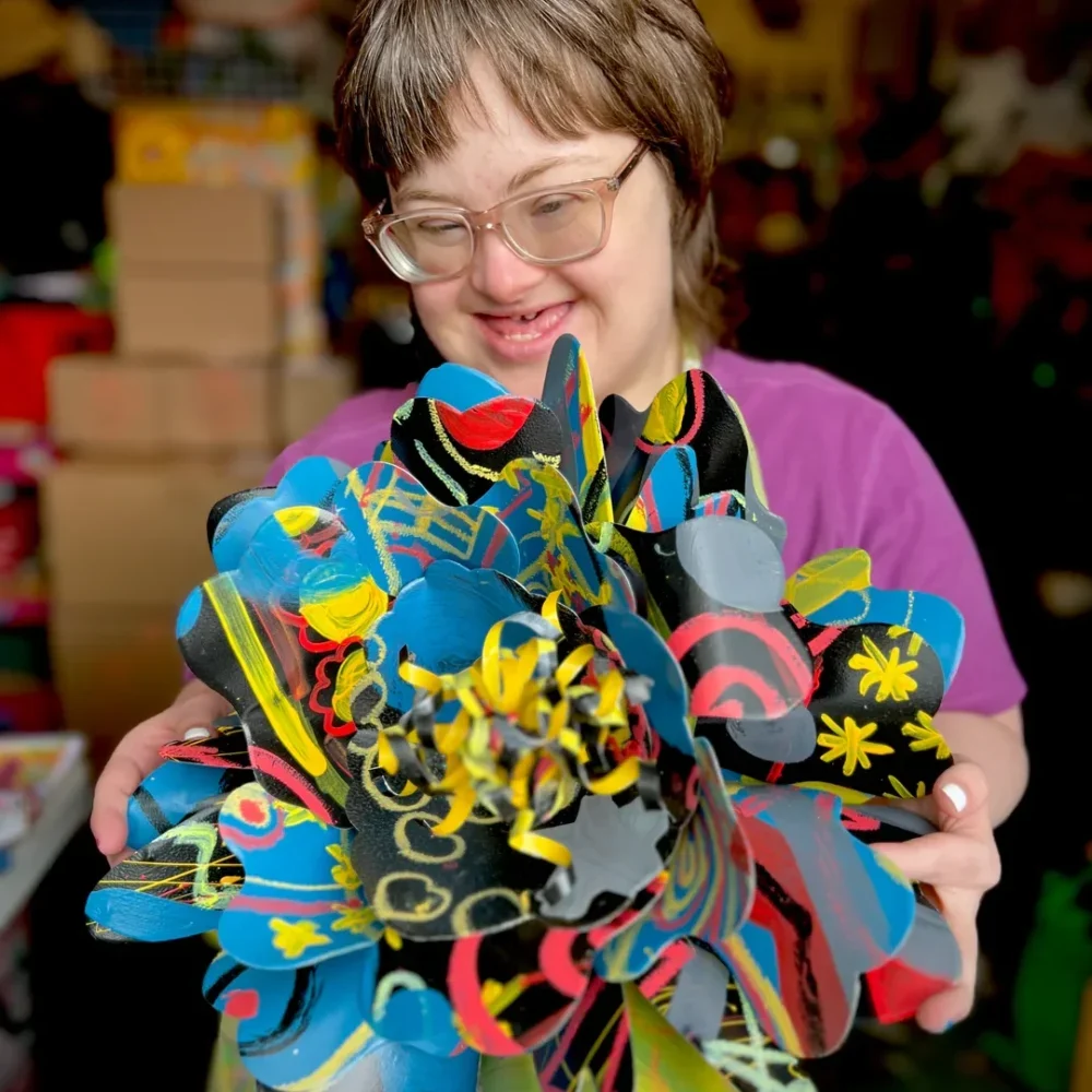 Girl with craft flowers at RMHC Central Ohio