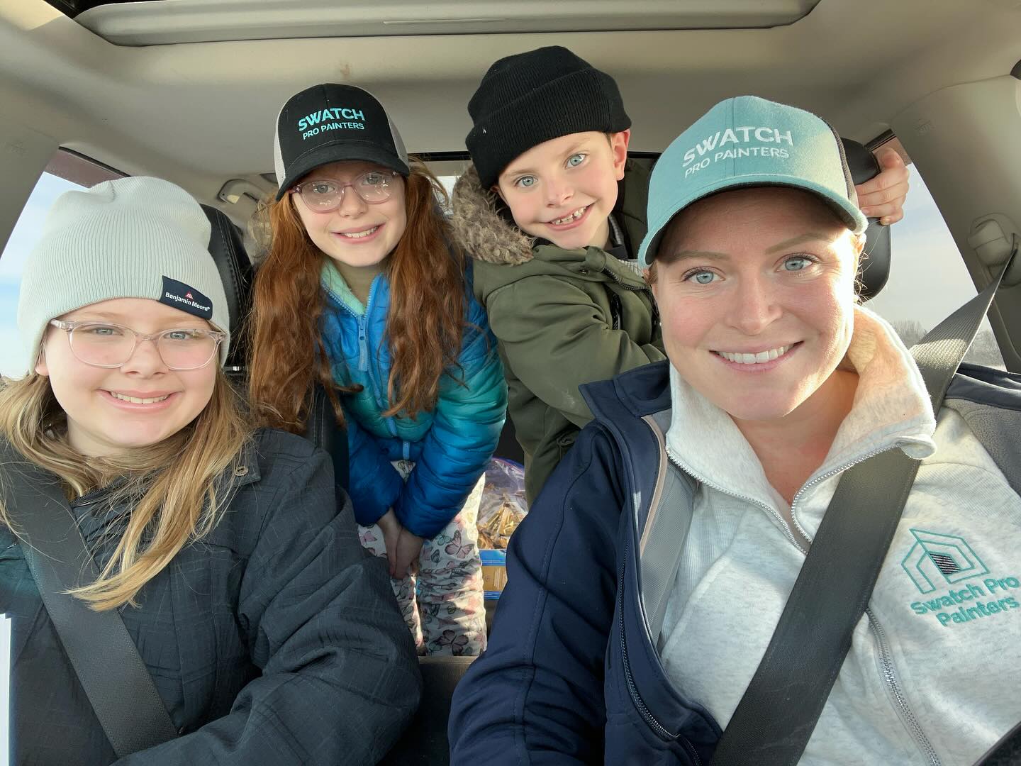 Tiffany with her three children in the car