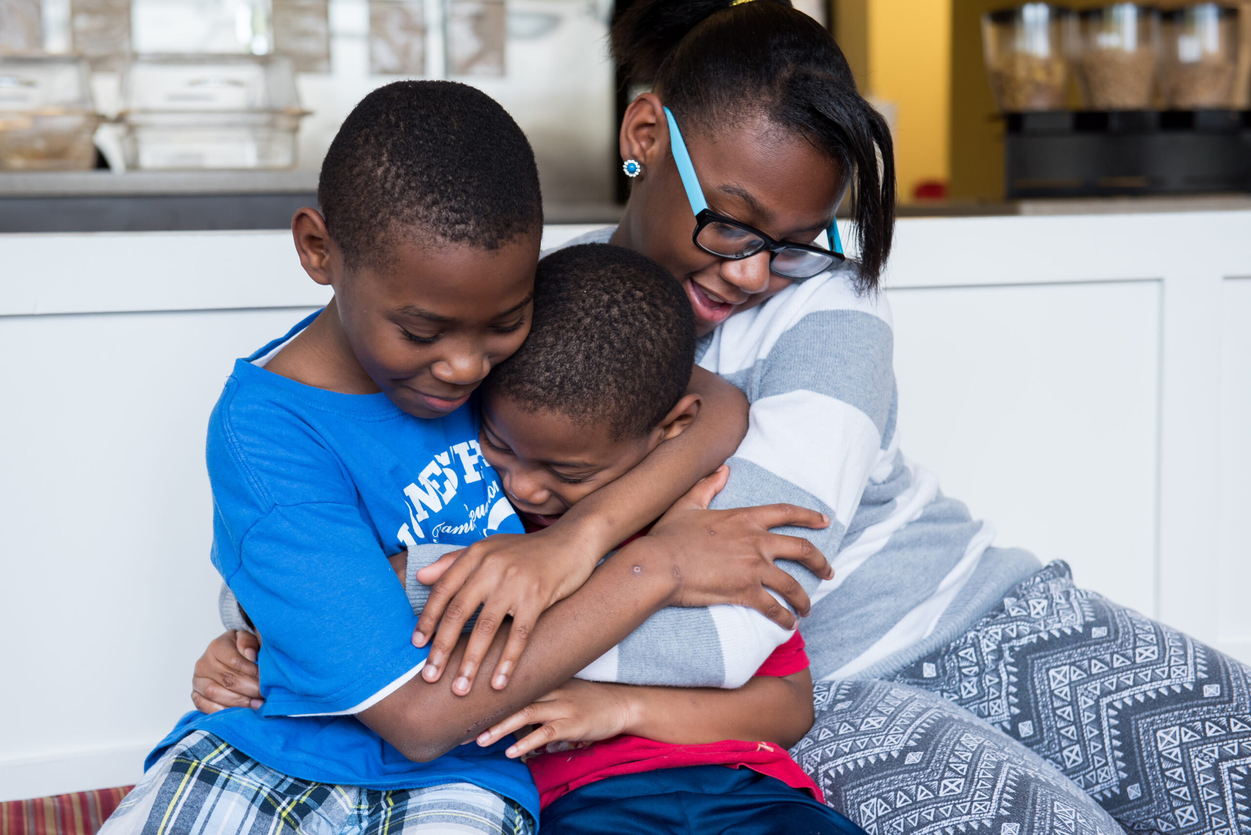 Three children hugging